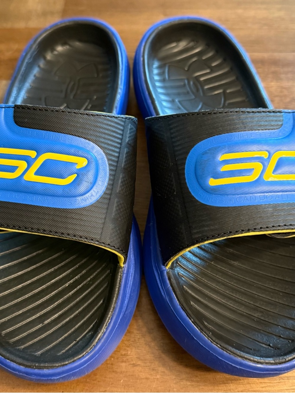 Under Armour Kids Blue and Black SC Slide Sandals with Yellow Logo